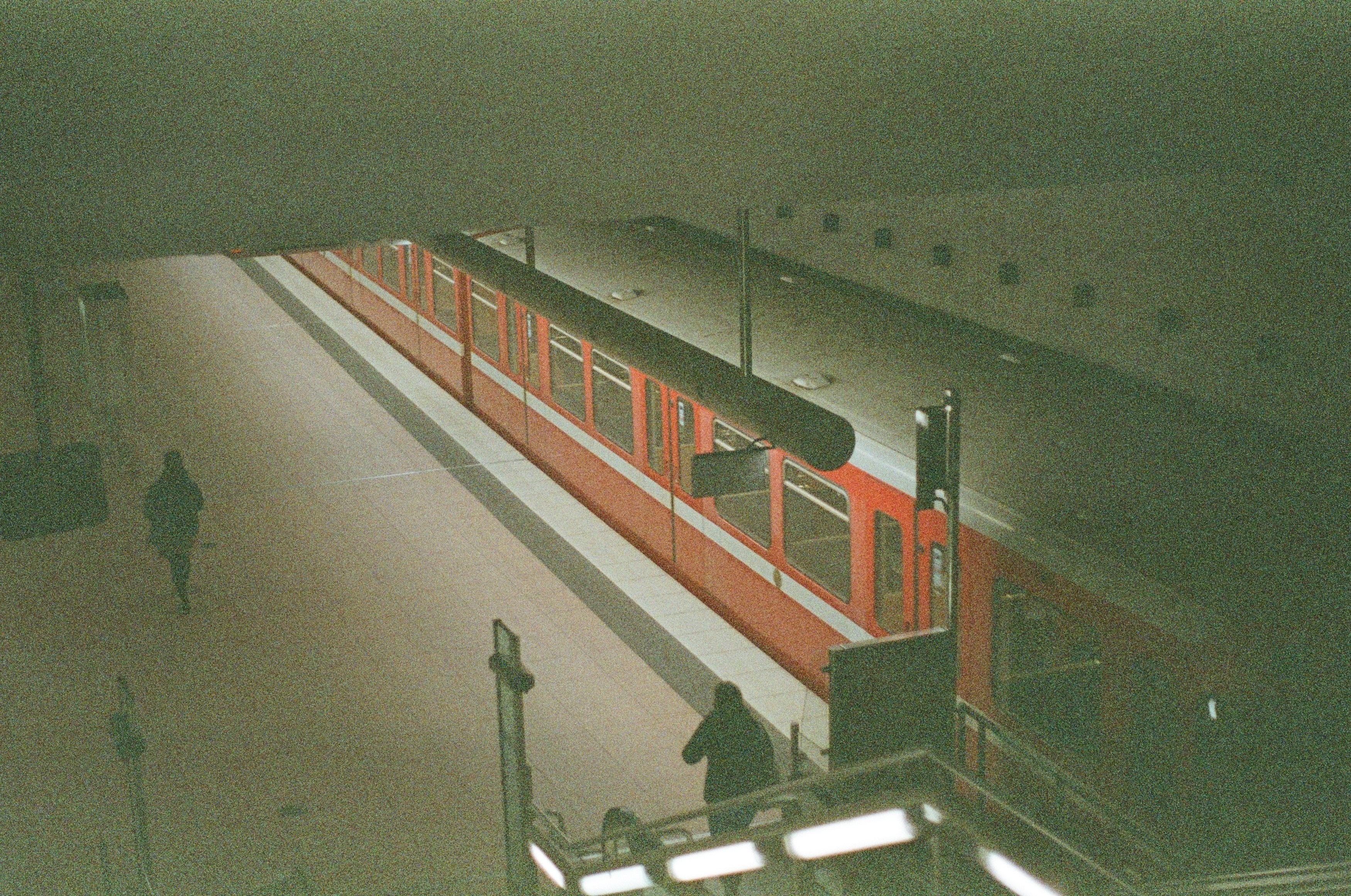 red and white train on train station